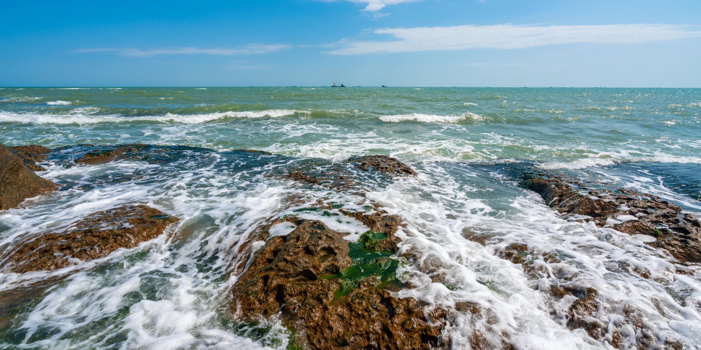 Rocky seashore and storm waves